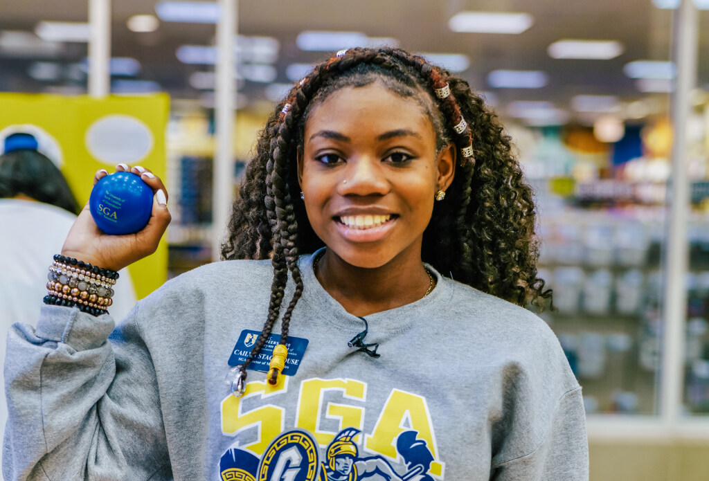 Cailyn Stackhouse holding an SGA 100th Session stress ball